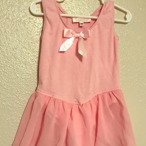 Pink girls leotard with attached skirt
